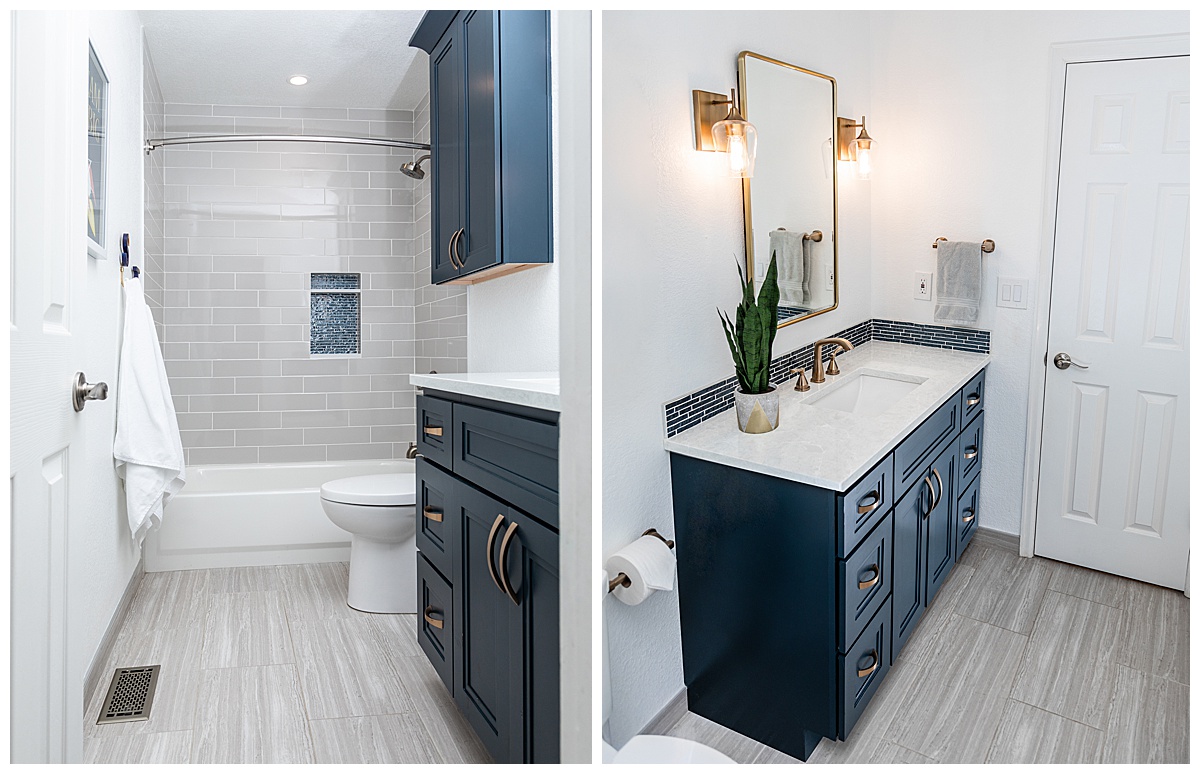 Photos of a bathroom. The vanity is dark teal with a white marble countertop and gold accents on the mirror and light sconces. The floor is gray wood and the shower is gray tile.